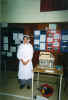 Lisa Wagner and a model of a charpente house 