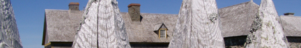 Louisbourg: Back of De la Vallire seen through a piquet fence